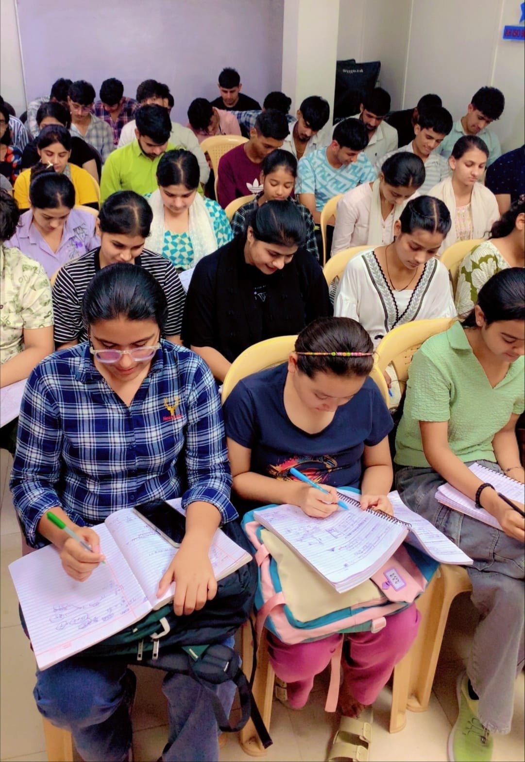 Students solving NDA practice worksheets
